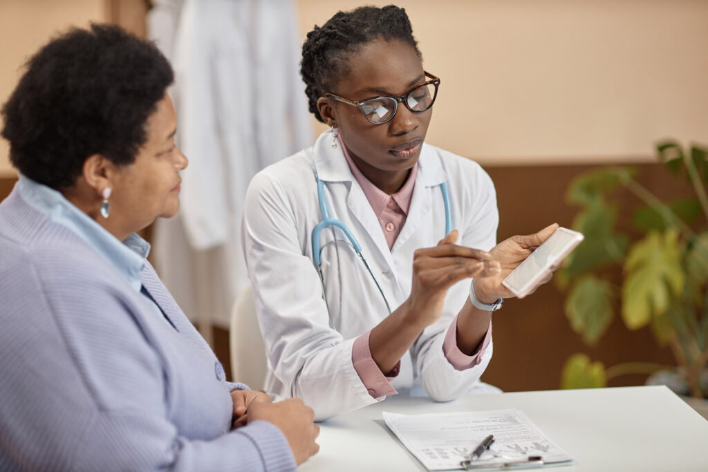 Senior woman receiving a health screening from a young doctor