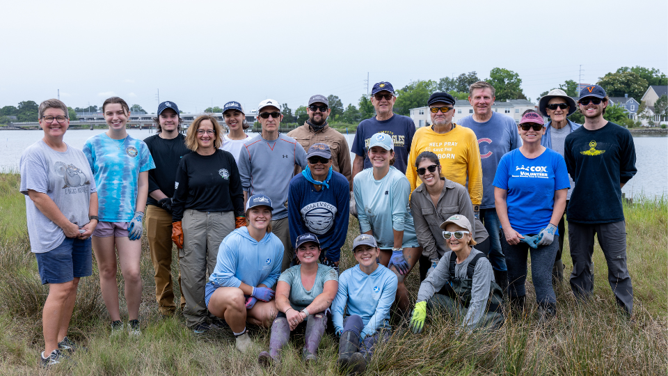 A photo of Marine and Environmental Sciences students with a river in the background.