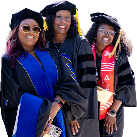A photo of a group of graduate students wearing academic regalia.