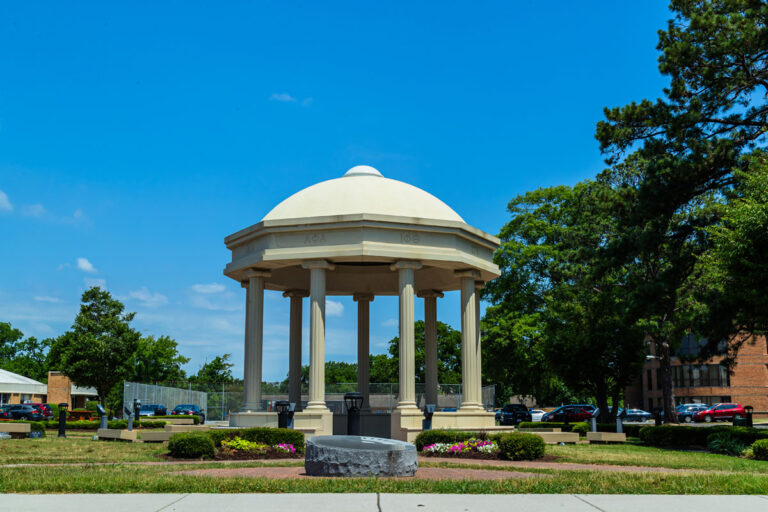 A photo of a stone and brick gazebo in the Greek Plaza.