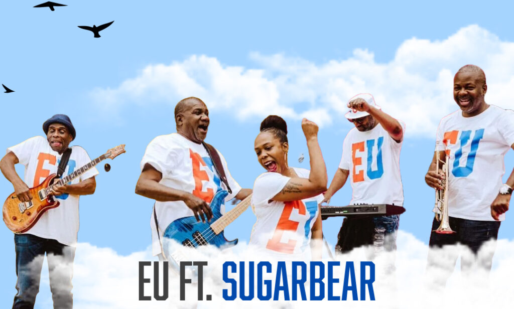 A graphic showing the band EU. The photo is taken from one their concerts while the band was playing. The text reads "EU Ft. Sugarbear."