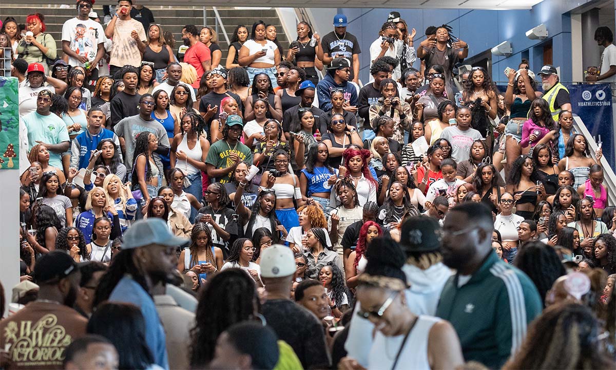 A candid photo showing a crowd of students standing on a large staircase facing the camera.