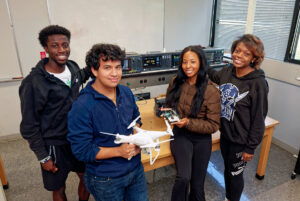 Hampton University Students in a classroom with a drone