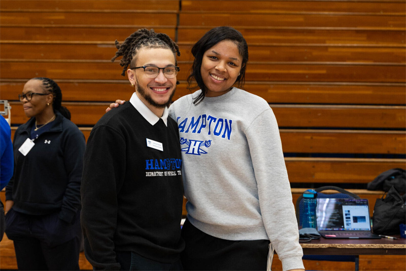 Two student clinicians pose for the camera.