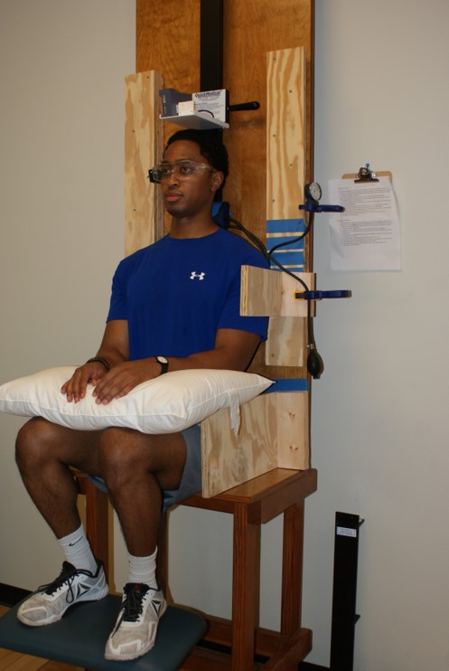 A photo of a student demonstrating the Stadiometry Research Lab.